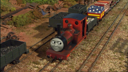 Rheneas next to some trucks of coal