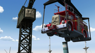 Flynn being lifted by Cranky in Day of the Diesels