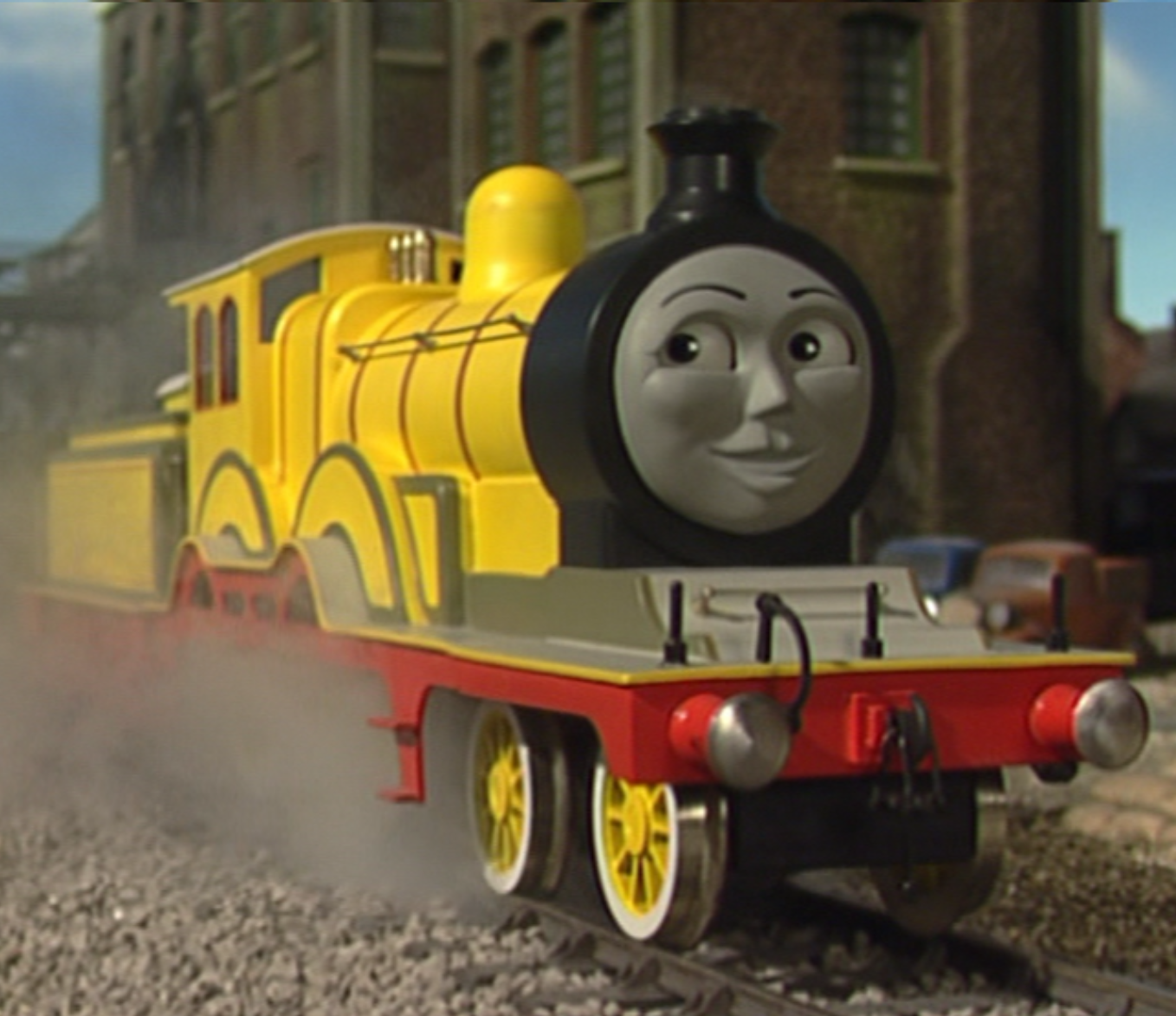 Toy cast iron train models of Molly (yellow) and Rosie (pink) from