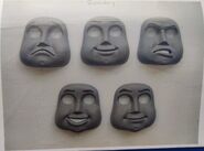 Rocky's faces (Note: Rocky's unused angry face next to his smiling face on the top right)