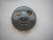 A production-made cast of Stepney's happy face on display in 2019