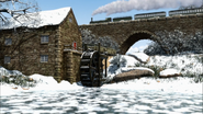 Emily passing the Watermill in winter