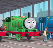 Percy with some workshop engines in a story library book