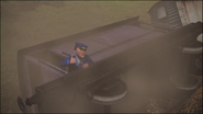 A guard climbing out of a derailed brake van