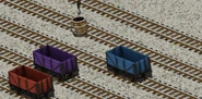 Red, purple, and blue 7-plank trucks