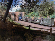 Thomas going under the bridge with the Breakdown Train