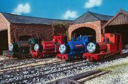 Sir Handel and Rheneas wearing each other's happy faces