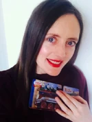 Rebecca O'Mara holding a Wooden Railway Caitlin