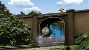Thomas attempting to get a giraffe under the bridge