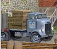 A grey stakebed lorry