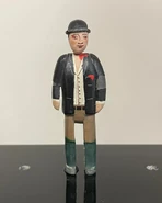 A small scale figurine of Farmer Collett on the Prop Gallery