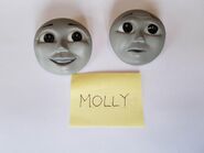 References of the earliest finished versions of Molly's happy and worried faces taken and owned by Hedges-Quinn