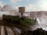 Percy in a pile of coal behind Tidmouth