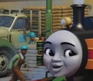 A green flatbed lorry