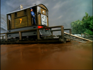 Toby being swept away by a flooded river