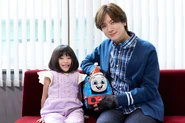 EmaKurataandDAIGO.jpeg (392 KB) Ema Kurata with DAIGO and a Thomas plush