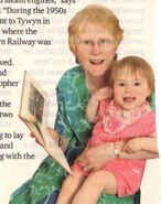 Hilary reading to granddaughter, Ruth, age 2 (2010)