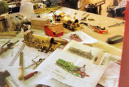 Photos during the model's construction (Note: Emily's model under construction in the foreground)