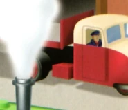 A carmine and cream lorry