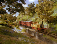 Stepney pulling two red coaches