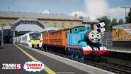 Thomas, Annie and Clarabel next to a BR Class 700