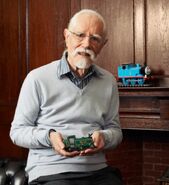 Christopher Awdry with a replica of the original wooden Thomas sent by Michael White