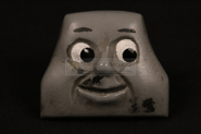 George's smiling face prior to being sold by The Prop Gallery (now owned by the preservation group Top Props)