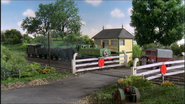 Duck waits at the level crossing with a faceless lorry