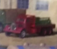 A red flatbed lorry