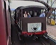 An LMS brake van with a Troublesome Truck face