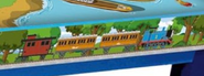 Thomas pulling Annie, Clarabel and a caboose on the Wooden Railway playtable