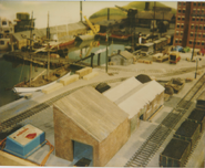 The fishing boats, a schooner, the LT Warehouse and the Three Berth Garage in a behind the scenes picture