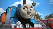 Thomas cringing at a crying baby