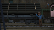 A flatbed carrying pipes