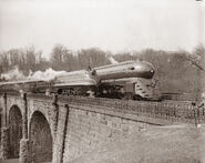 Duchess of Hamilton running alongside a member of Caitlin's basis during her 1939 United States tour.