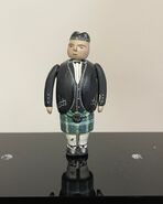 A small scale figurine of Sir Topham Hatt in a kilt prior to being sold by the Prop Gallery