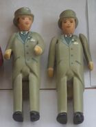 Two of the wedding guests' figurines in 2019