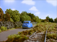 (Note: There is green foliage covering the tracks)