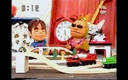Puppet "Minicchi" and "Kobattom" at their Wooden Railway table