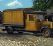 An orange-brown cargo lorry