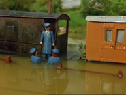 A brake van partially submerged in water