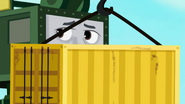 Cranky hiding behind an intermodal container