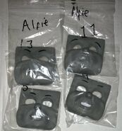 Alfie's happy, smiling, seething and sad faces in storage bags as previously owned by a private collector