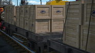 Flatbeds carrying crates of fish