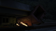 A derailed hopper caught on the flatbed for Captain Calles' Pirate Ship
