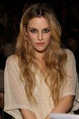 Michelle Boback (Riley Keough)