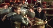 Henry, injured during a tournament in Season Two, carried by Charles Brandon and Dr. Linnerker.