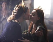 Anne of Cleves kisses her ex-step-daughter, Elizabeth Tudor.