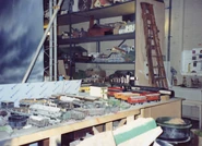 The Church building on the top shelf and one of the cranes on the middle shelf in a behind the scenes photo of the third series of Thomas & Friends.