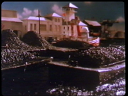 Fire Tug Behind a Coal Barge